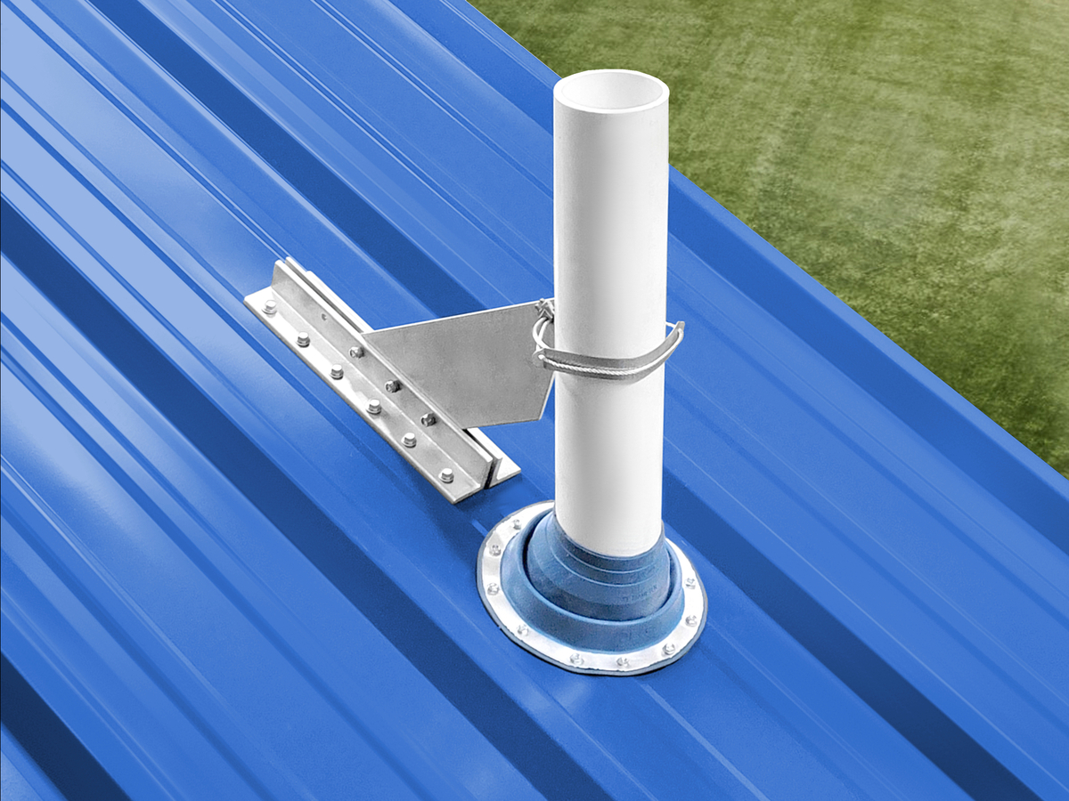 VentSaver vent protection system installed on a screw-down metal roof beside a vent pipe